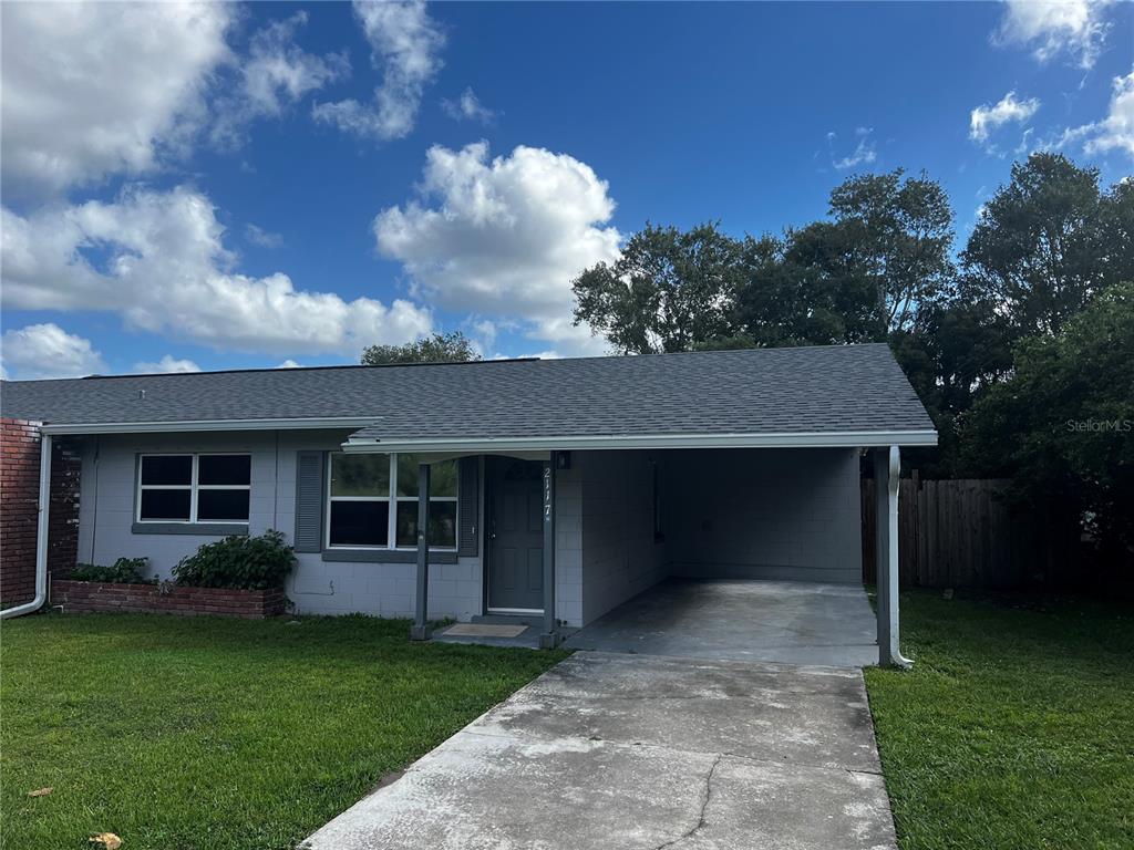 a view of a house with a yard