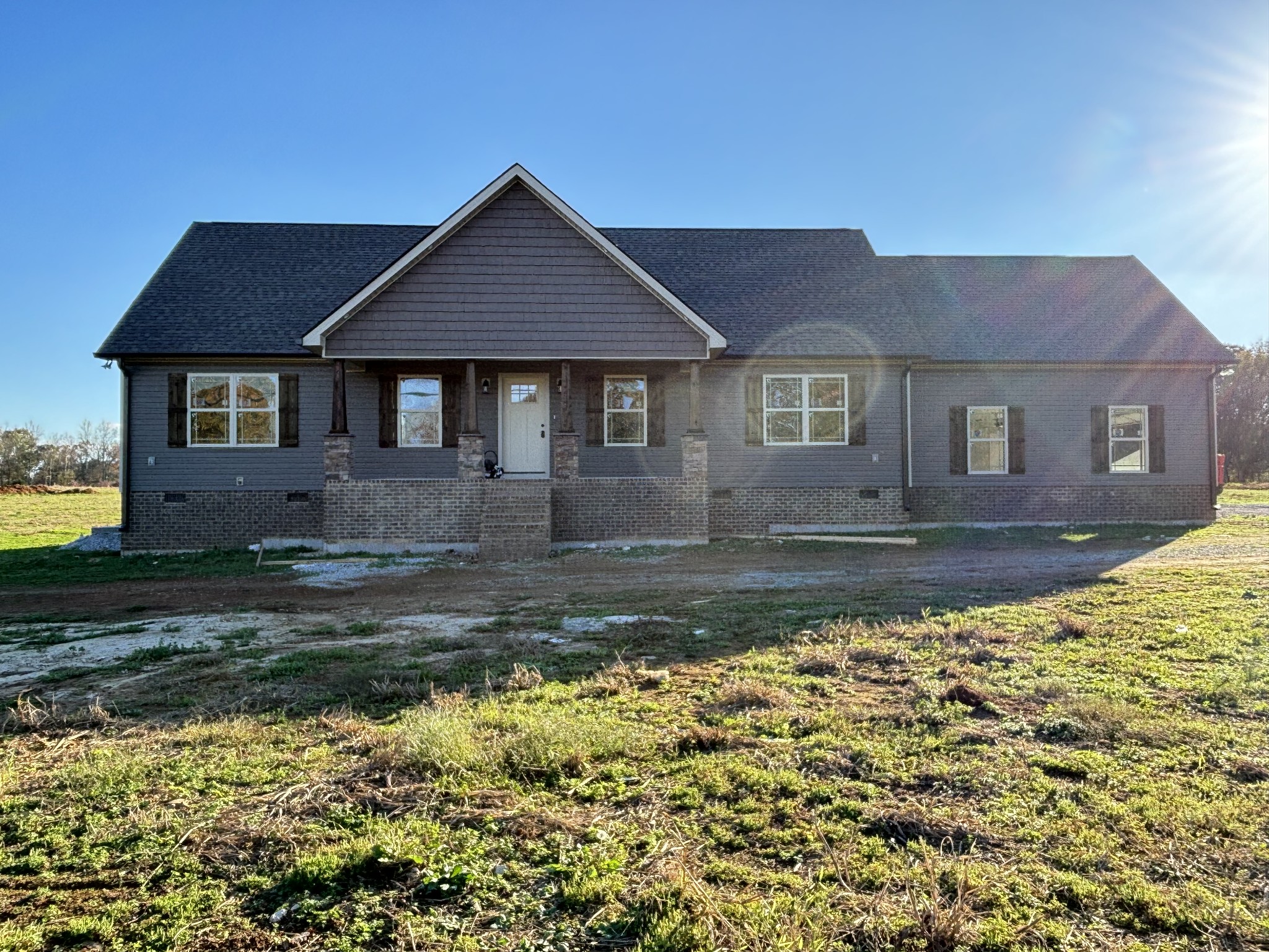 a front view of a house with a yard