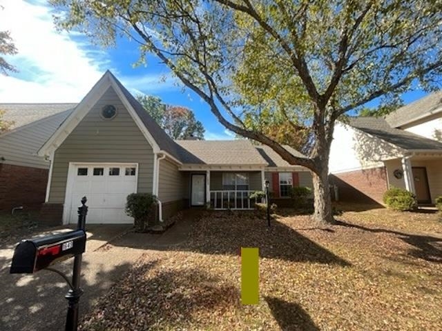 a view of house with yard