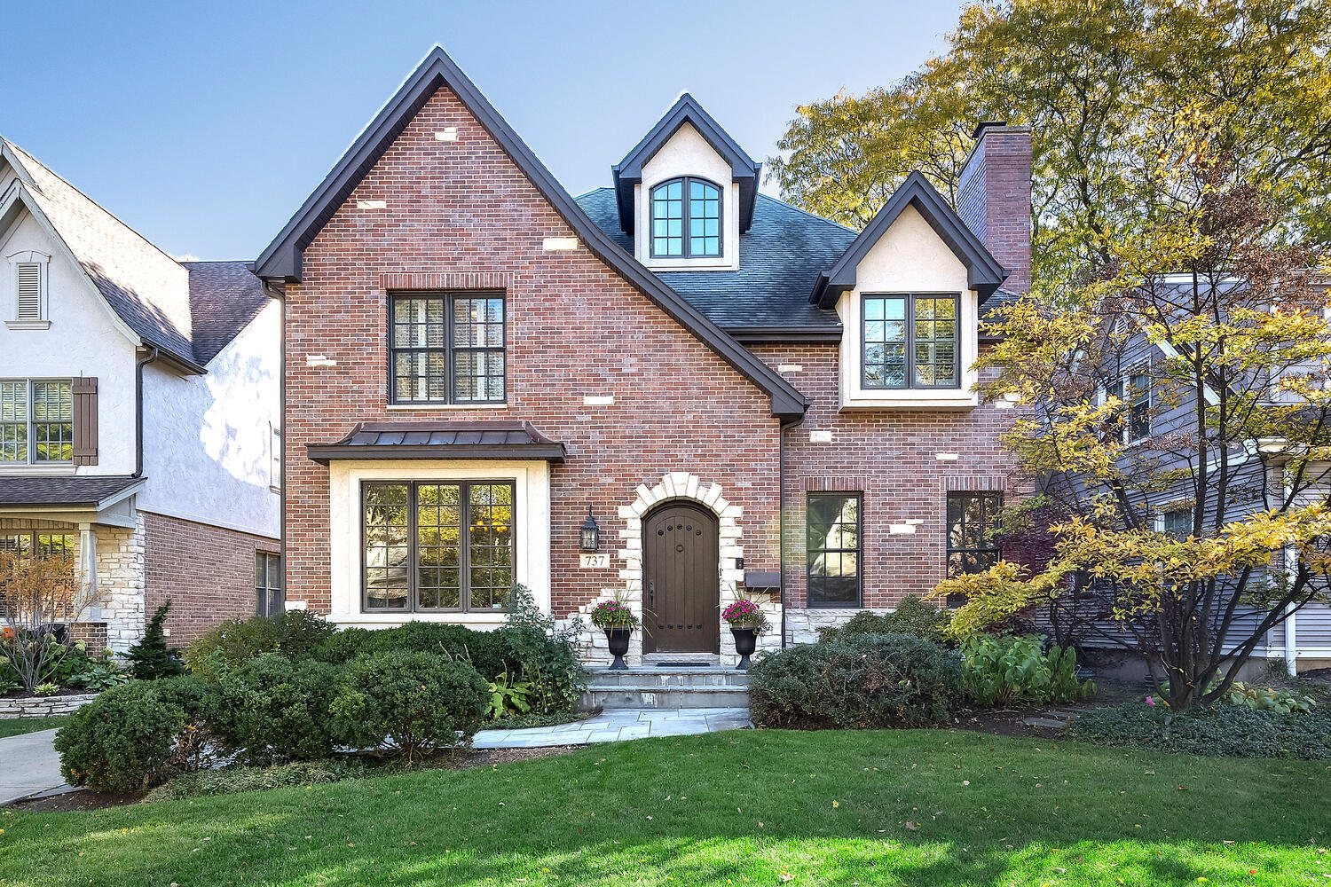 a front view of a house with garden