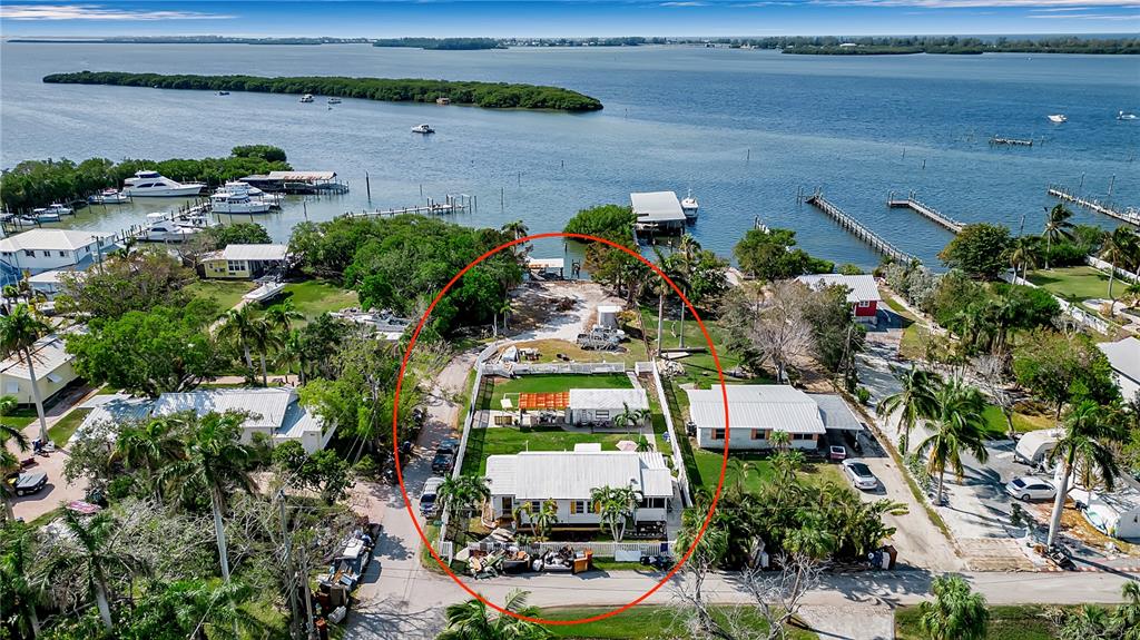 an aerial view of a house with a lake view