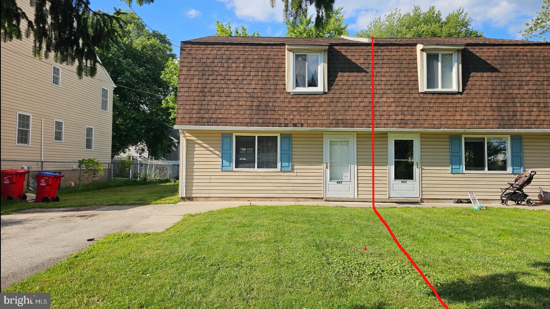 a front view of a house with a yard and porch