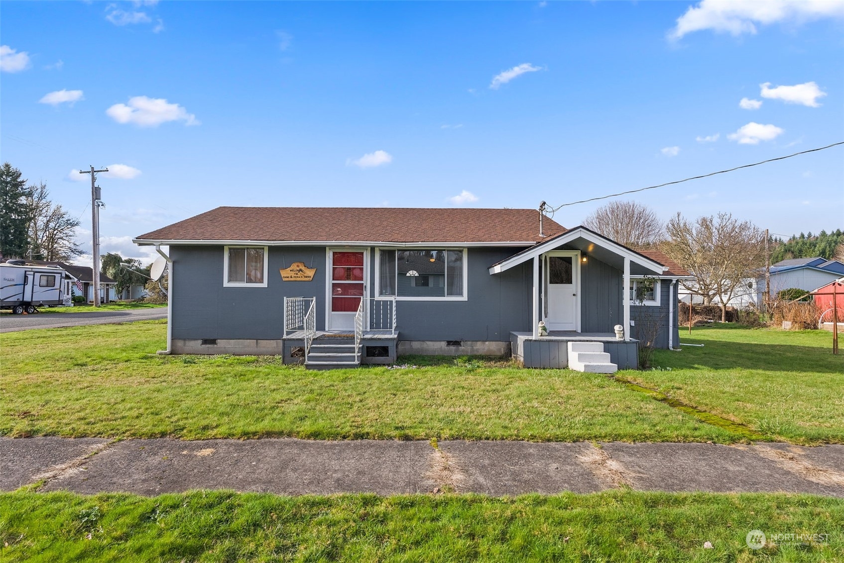 a front view of a house with a yard