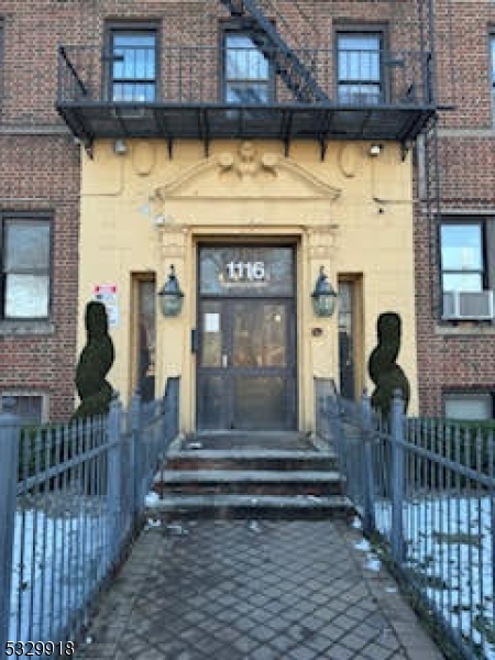 a view of front door of house with stairs