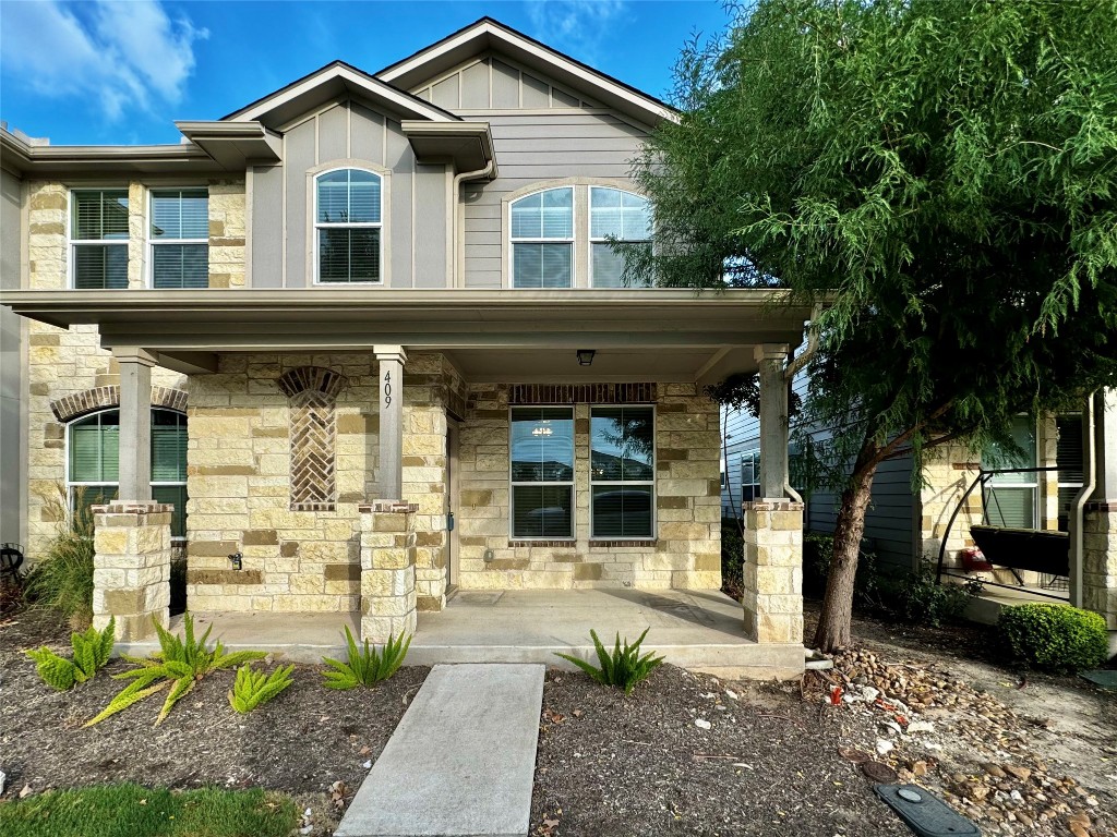 a front view of a house with garden