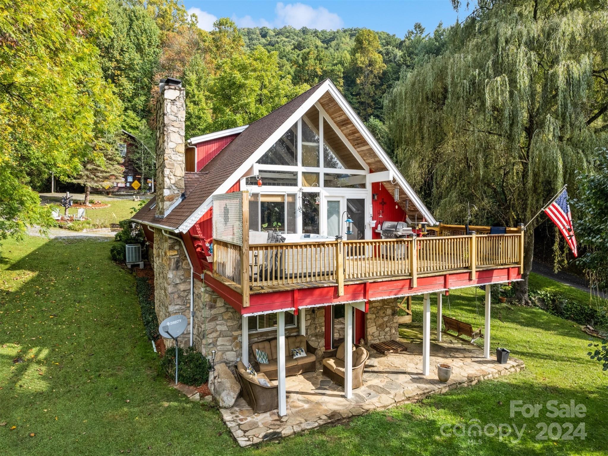 a view of a house with a yard and balcony