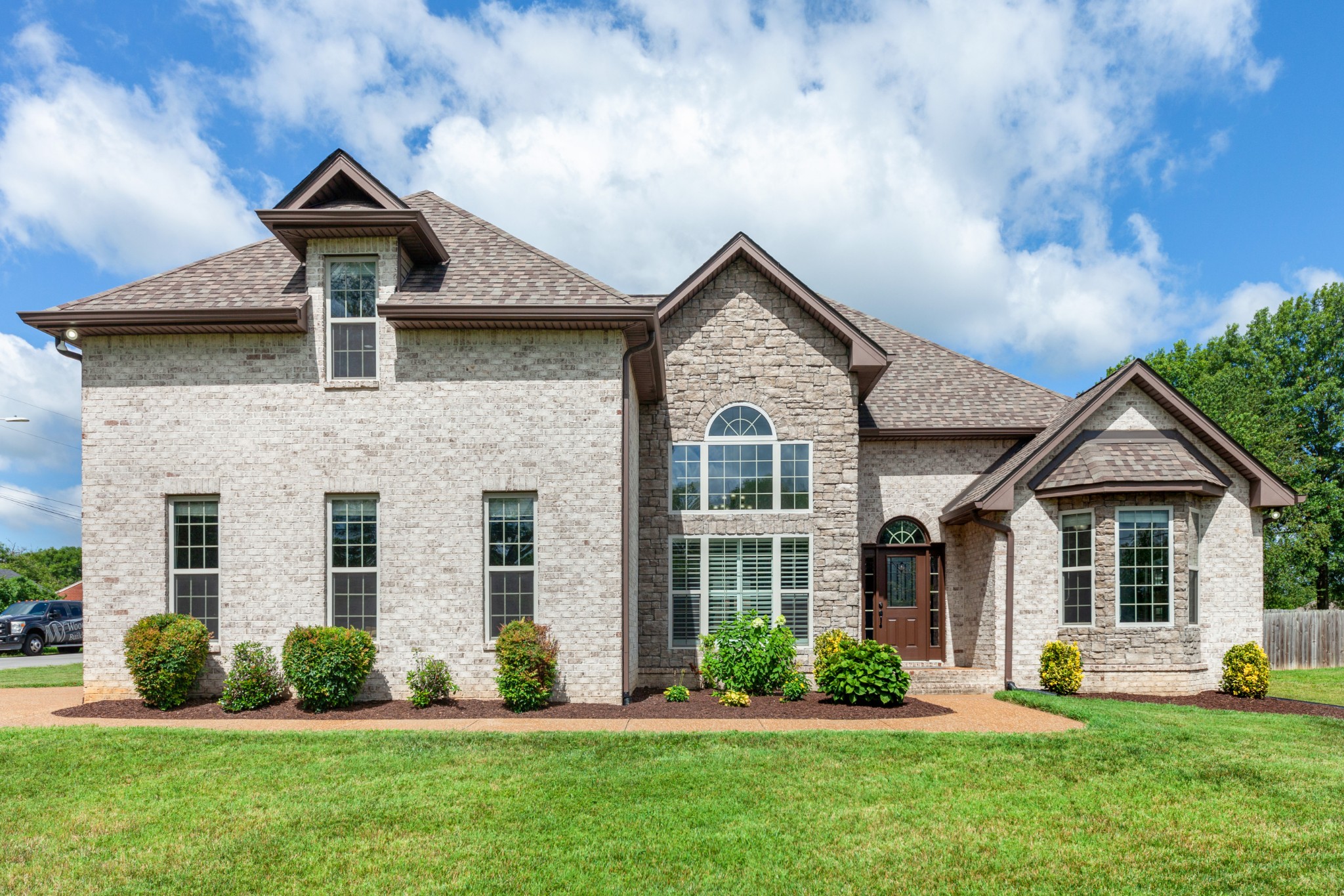 front view of a house with a yard