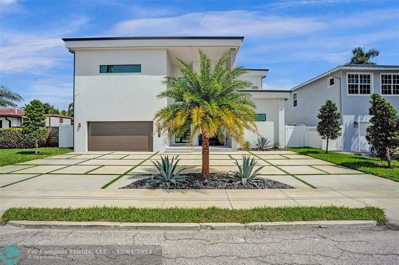 a house with palm tree in front of it