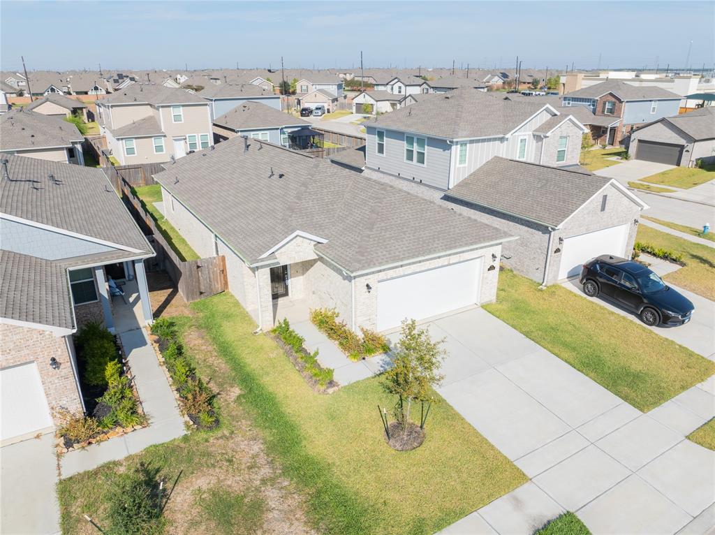 an aerial view of a house with a swimming pool