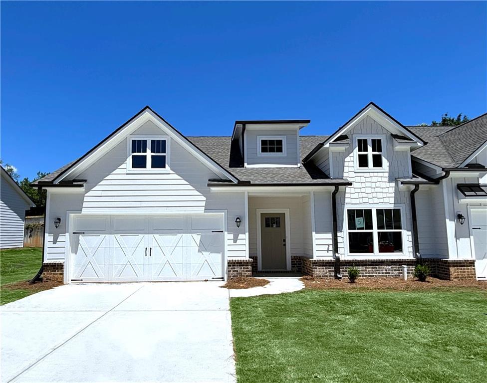 a front view of a house with a yard