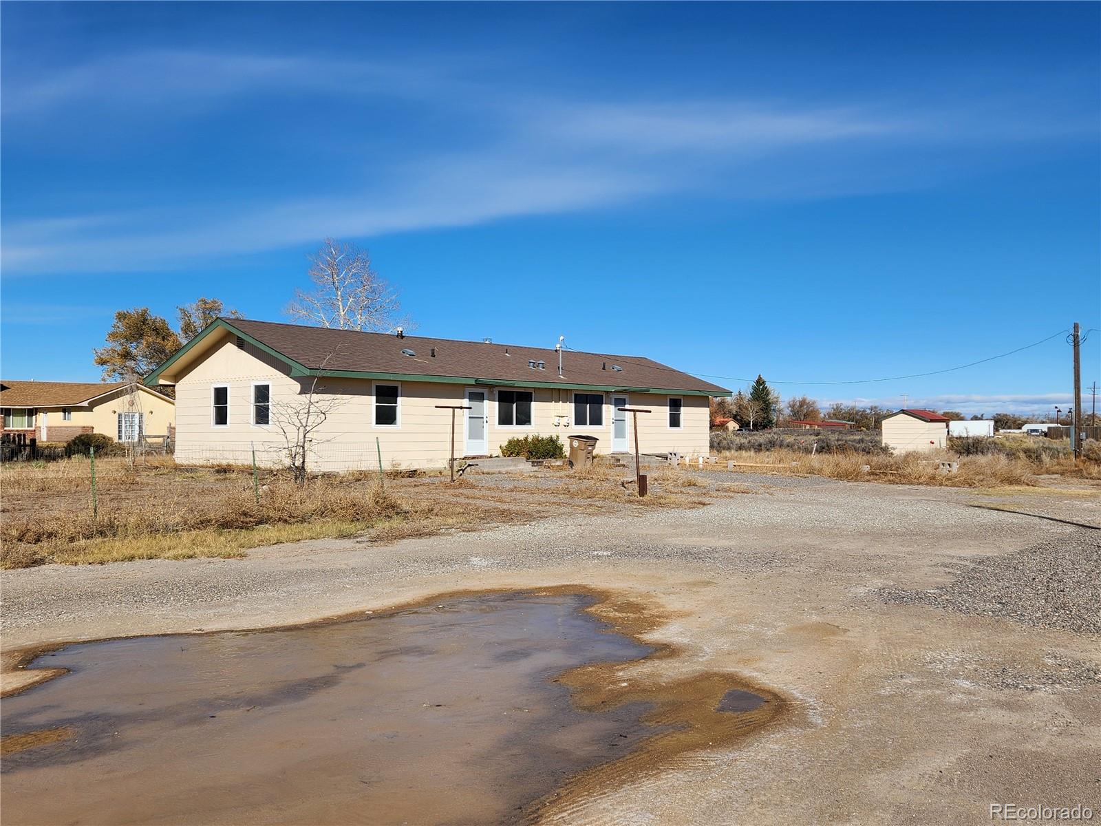 a view of houses with outdoor space and street view