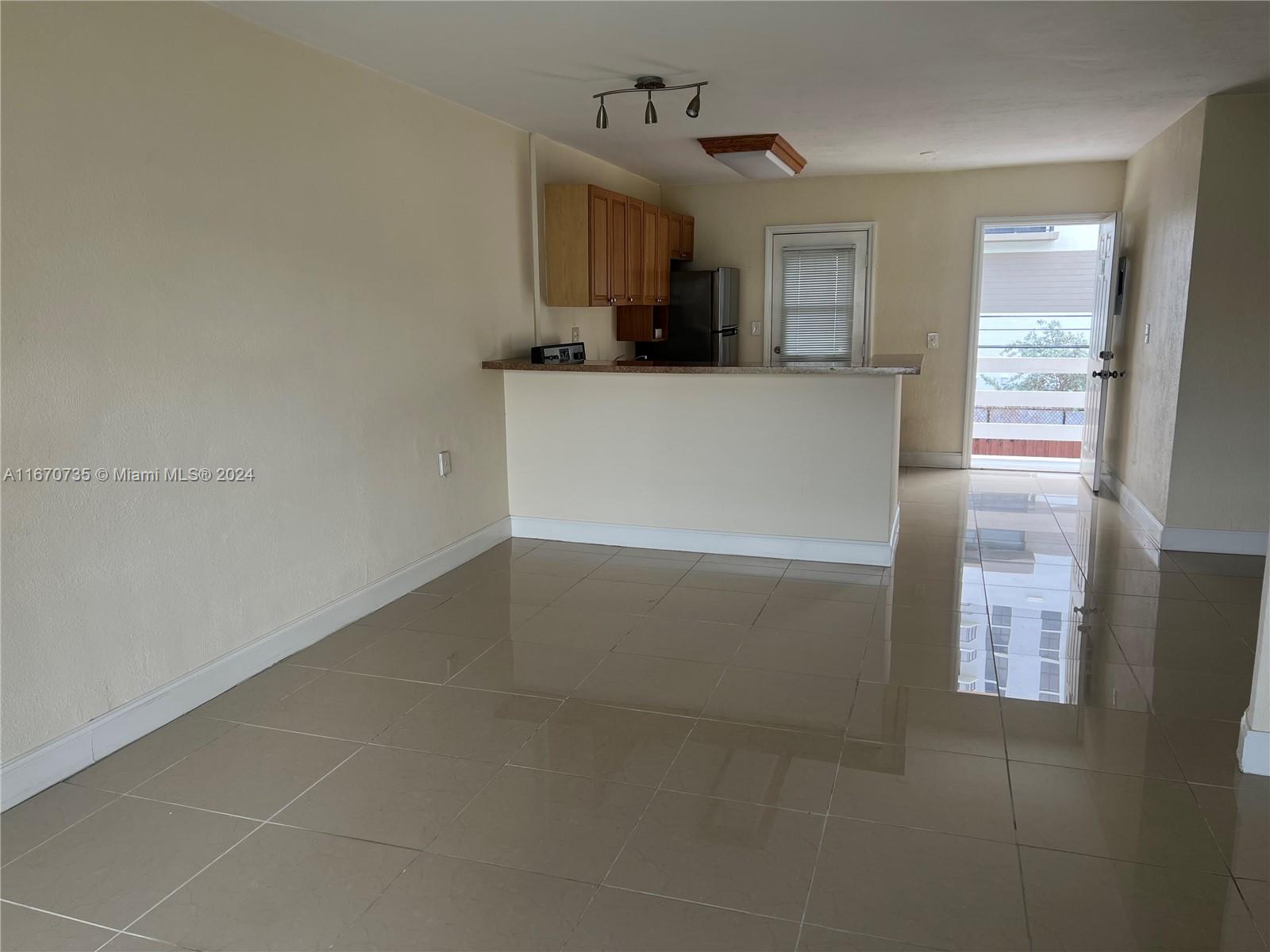 a view of a kitchen cabinets and a window