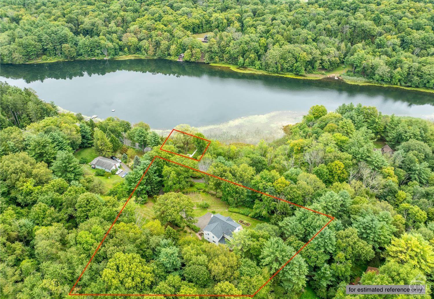 an aerial view of a houses with a lake view