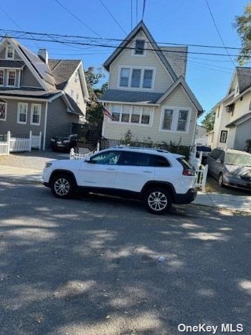 a car parked in front of a house