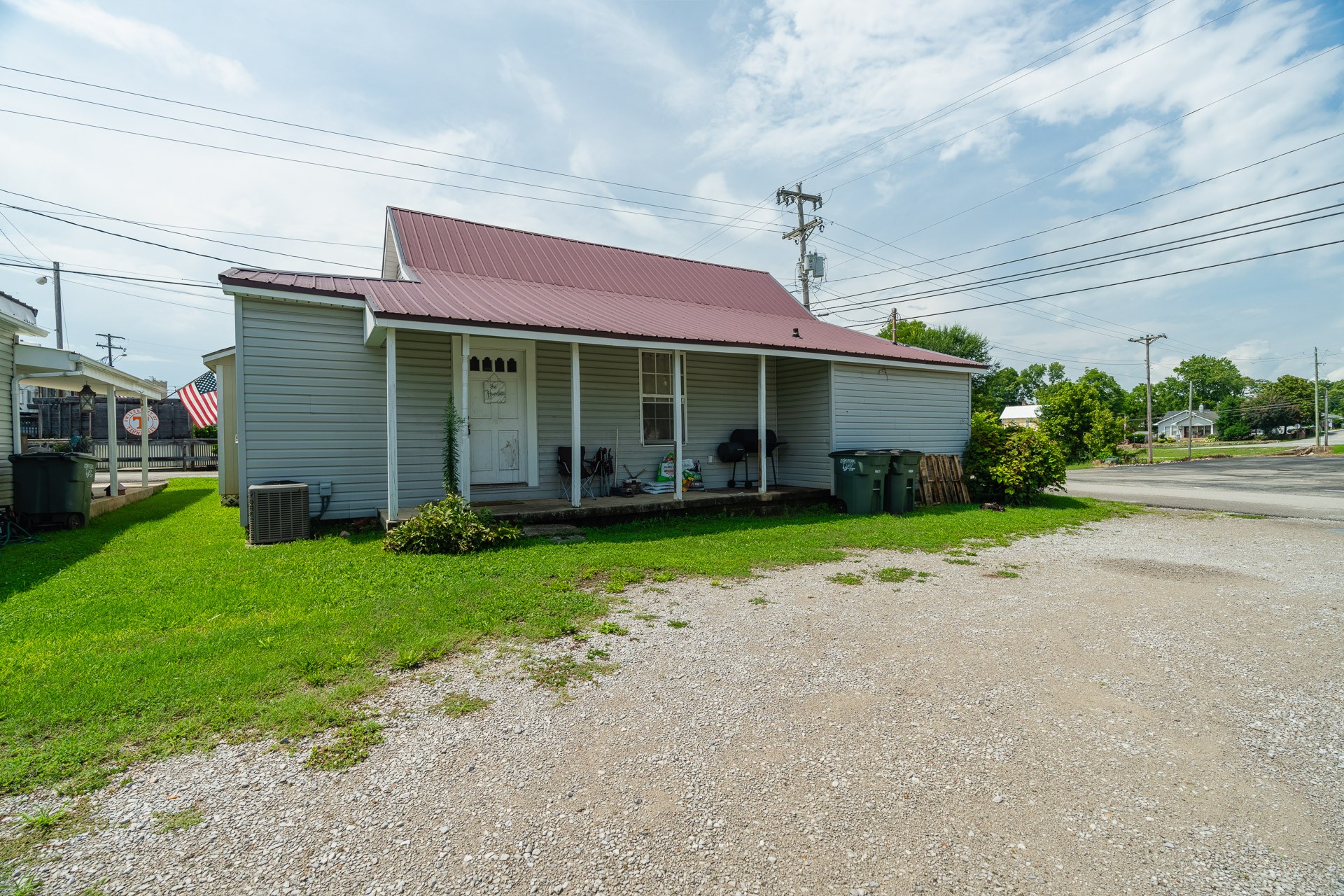 a front view of a house with a garden and plants