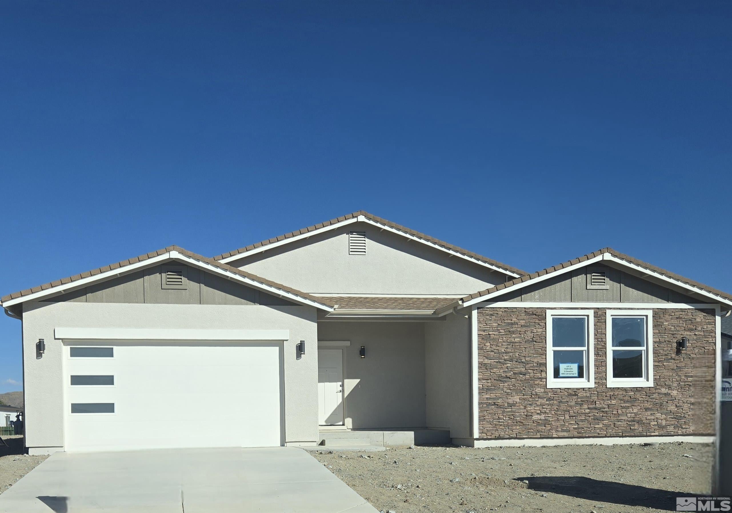 a front view of a house with yard