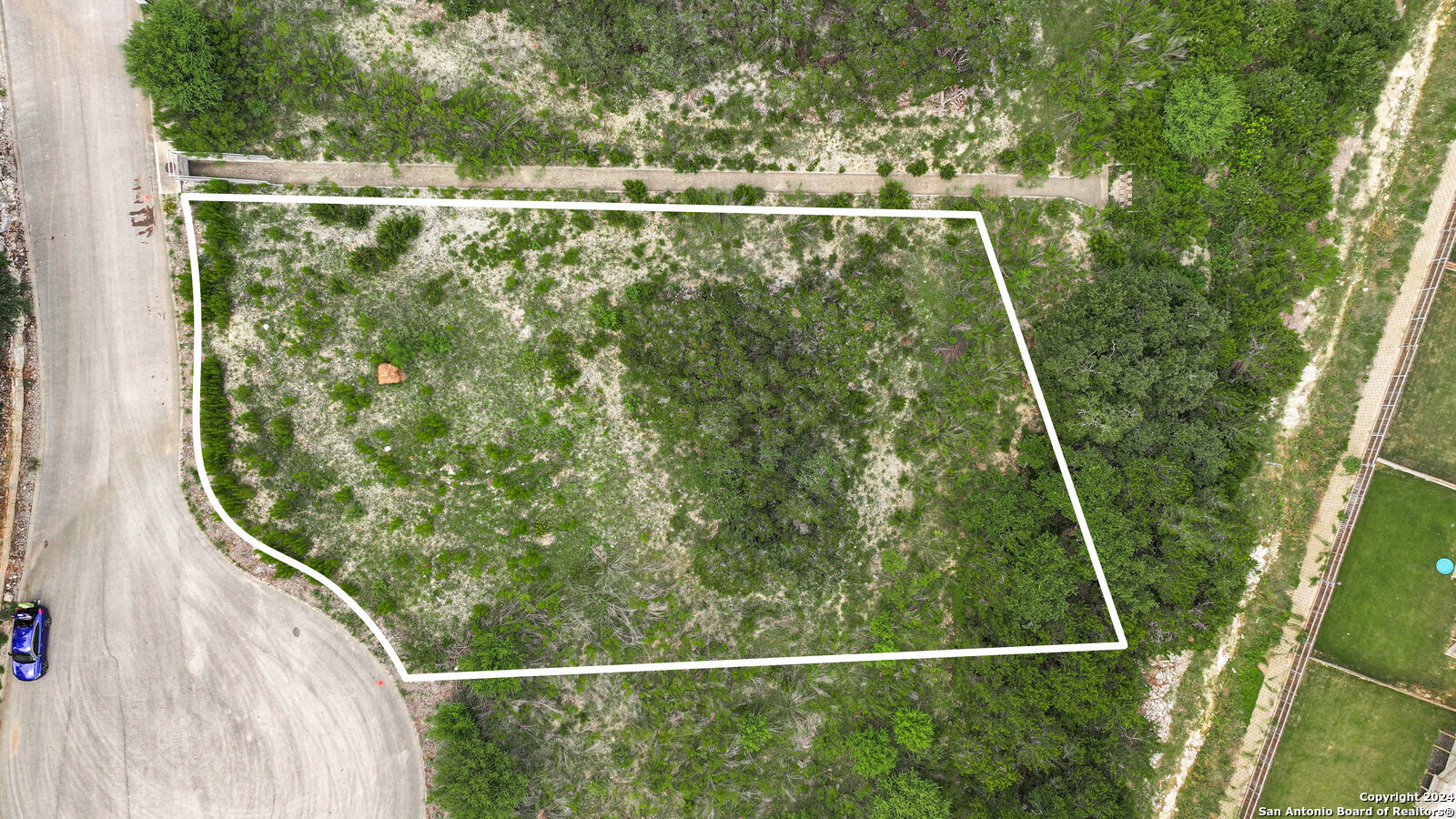 a view of a yard and deck