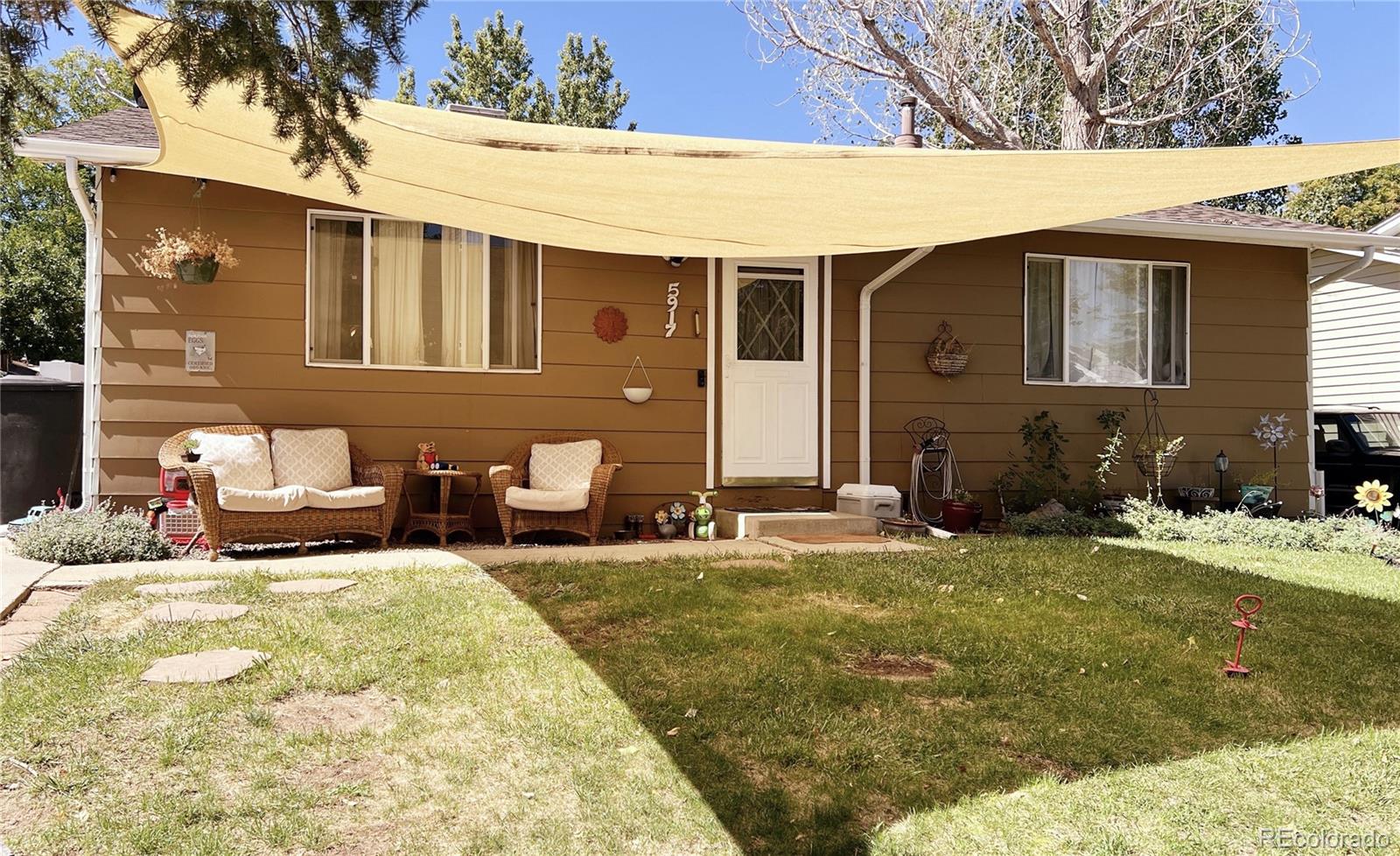 a backyard of a house with yard and seating space