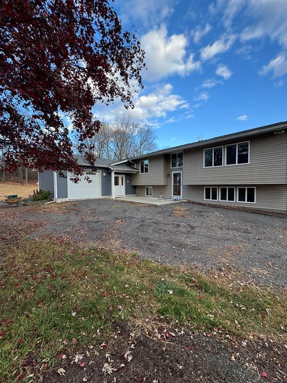 View of front of property with a garage