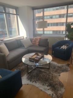 a living room with furniture and a window