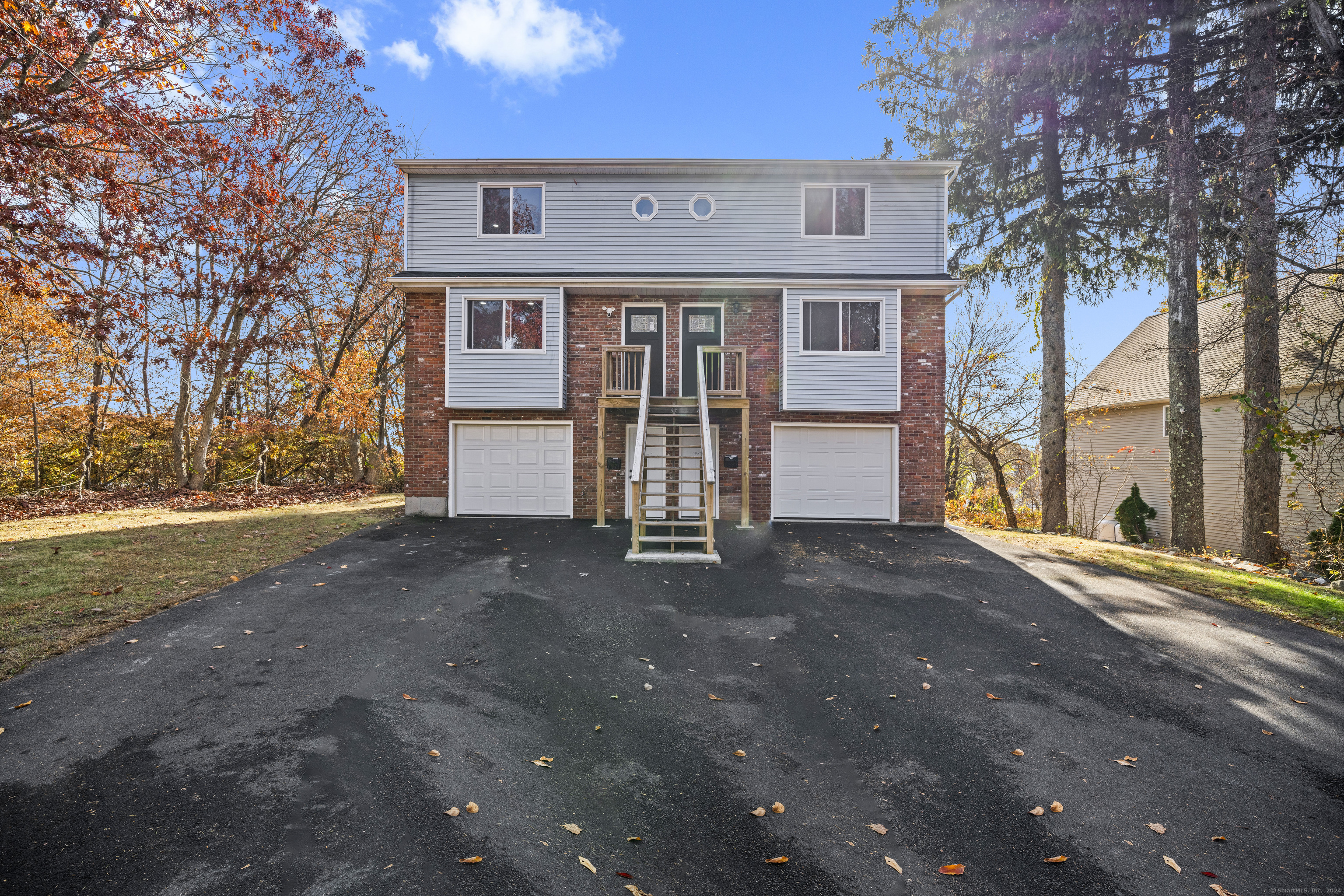 a front view of a house with parking space