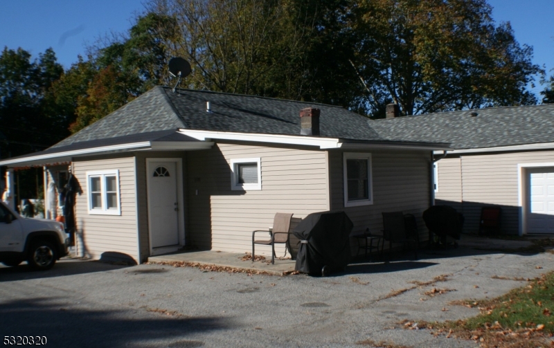 a view of a car parked in front of a house