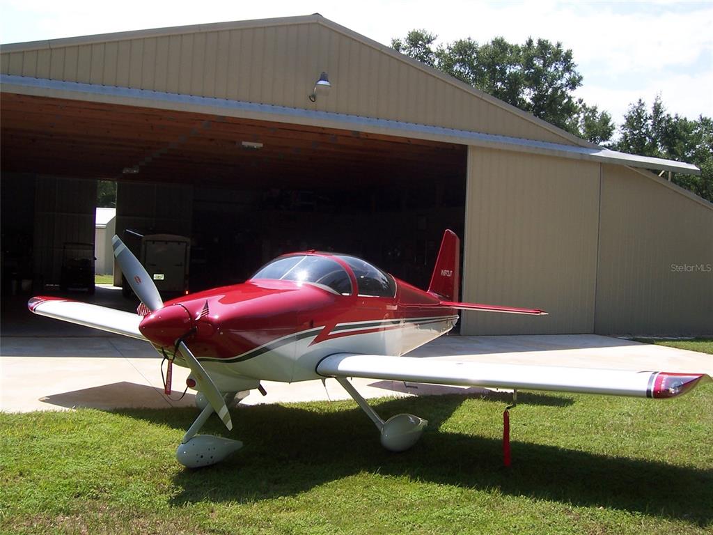 Hangar with attached home. Hangar door opens 49' wide.