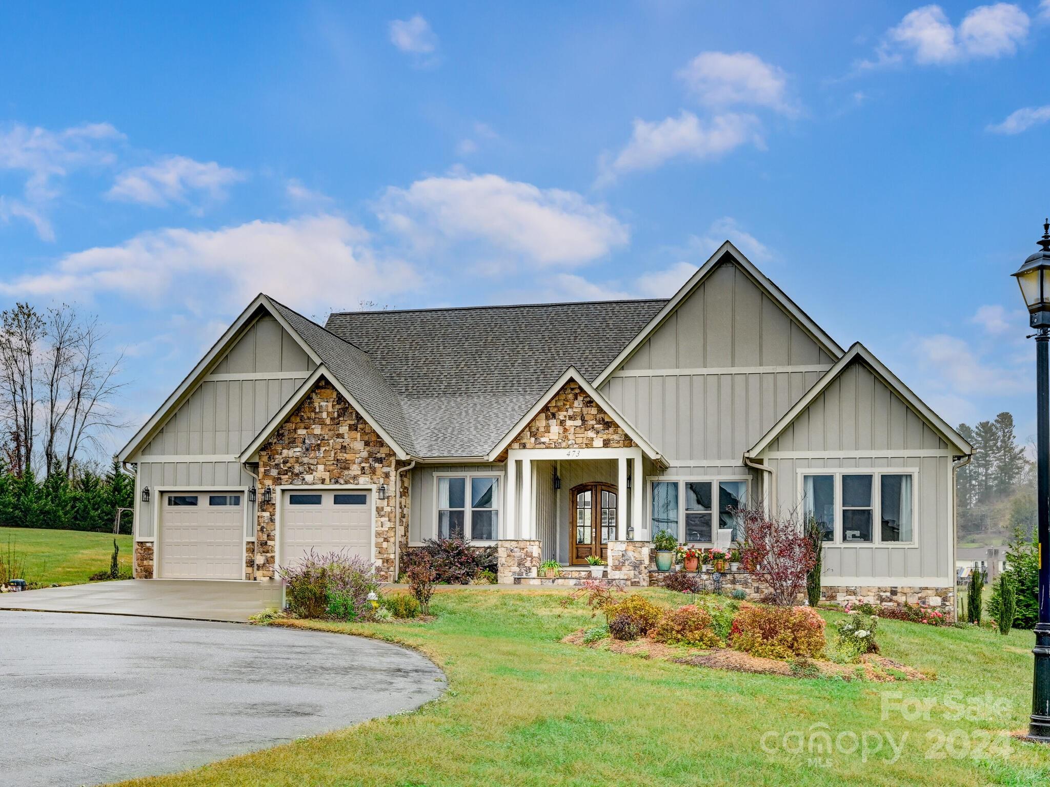 a view of house with yard and entertaining space