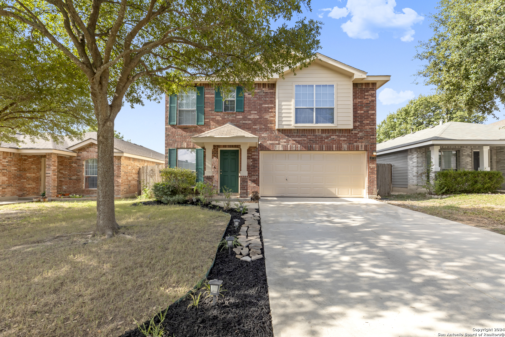 a front view of a house with yard