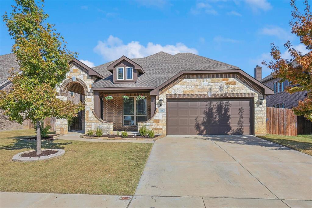 a front view of a house with yard