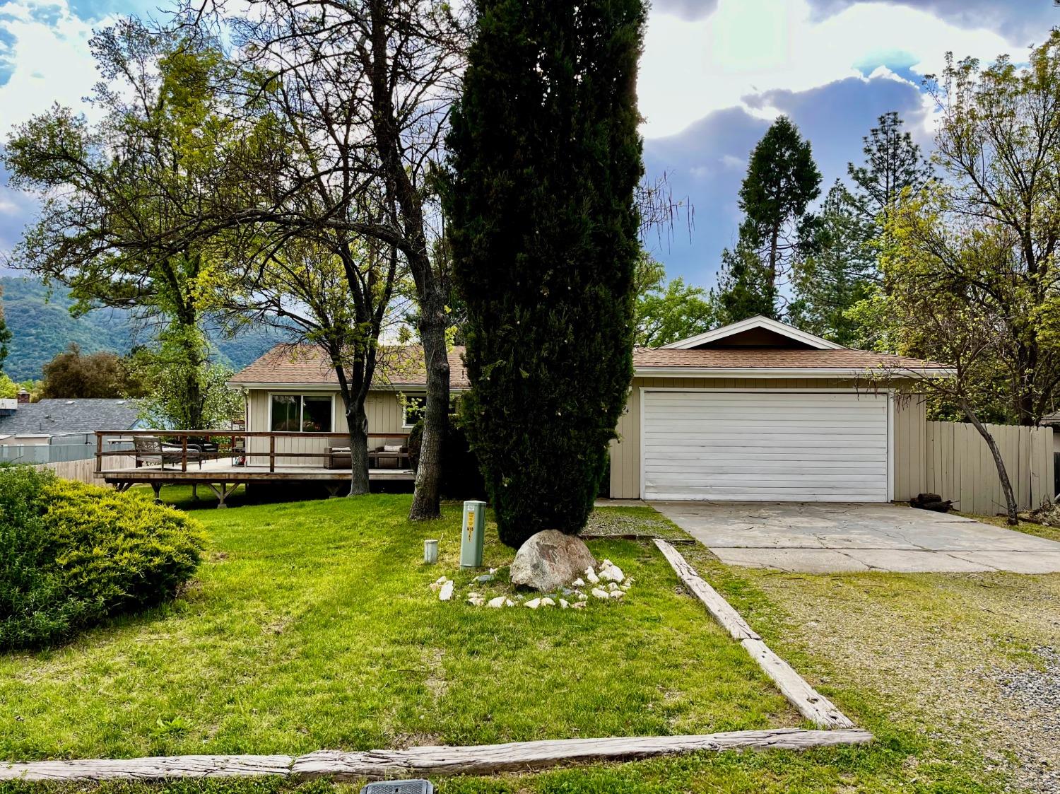 a view of a house with swimming pool and sitting area