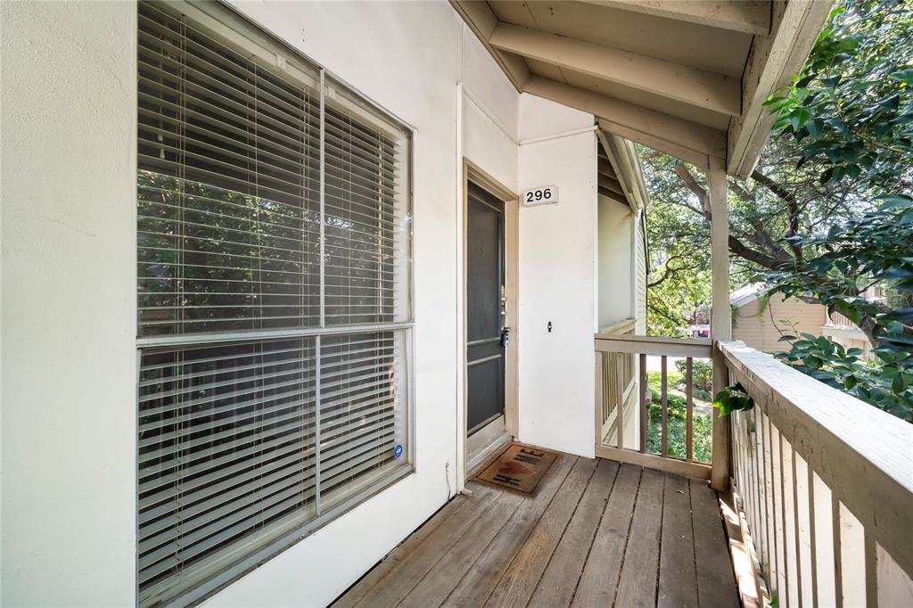 a view of balcony with wooden floor