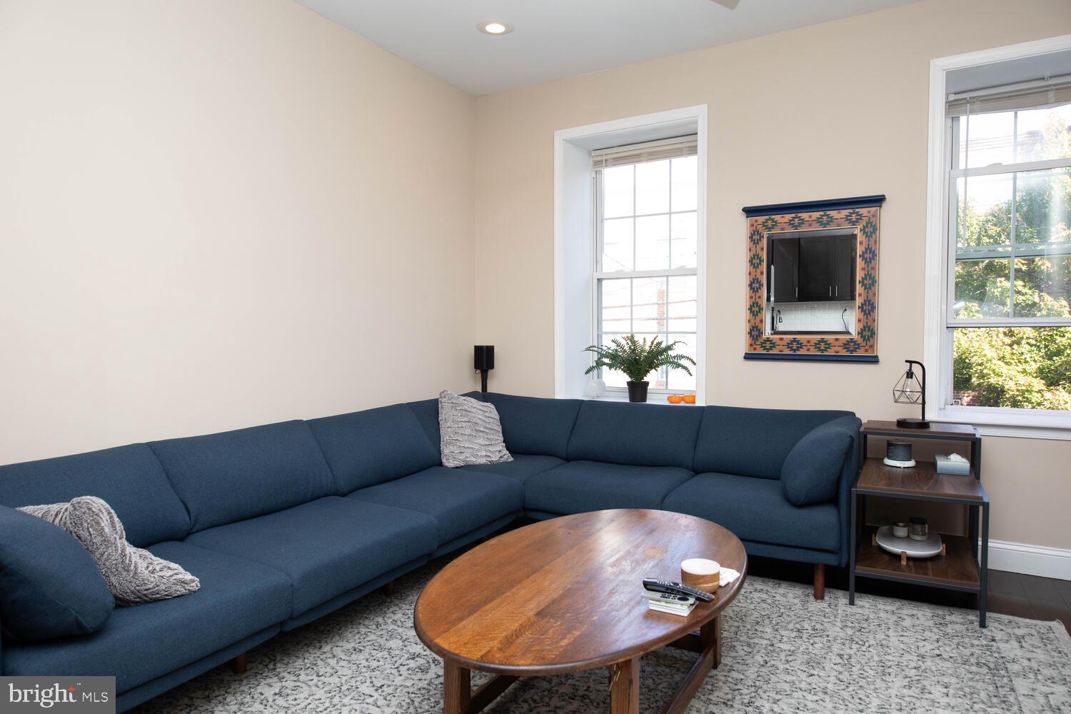 a living room with furniture and a window