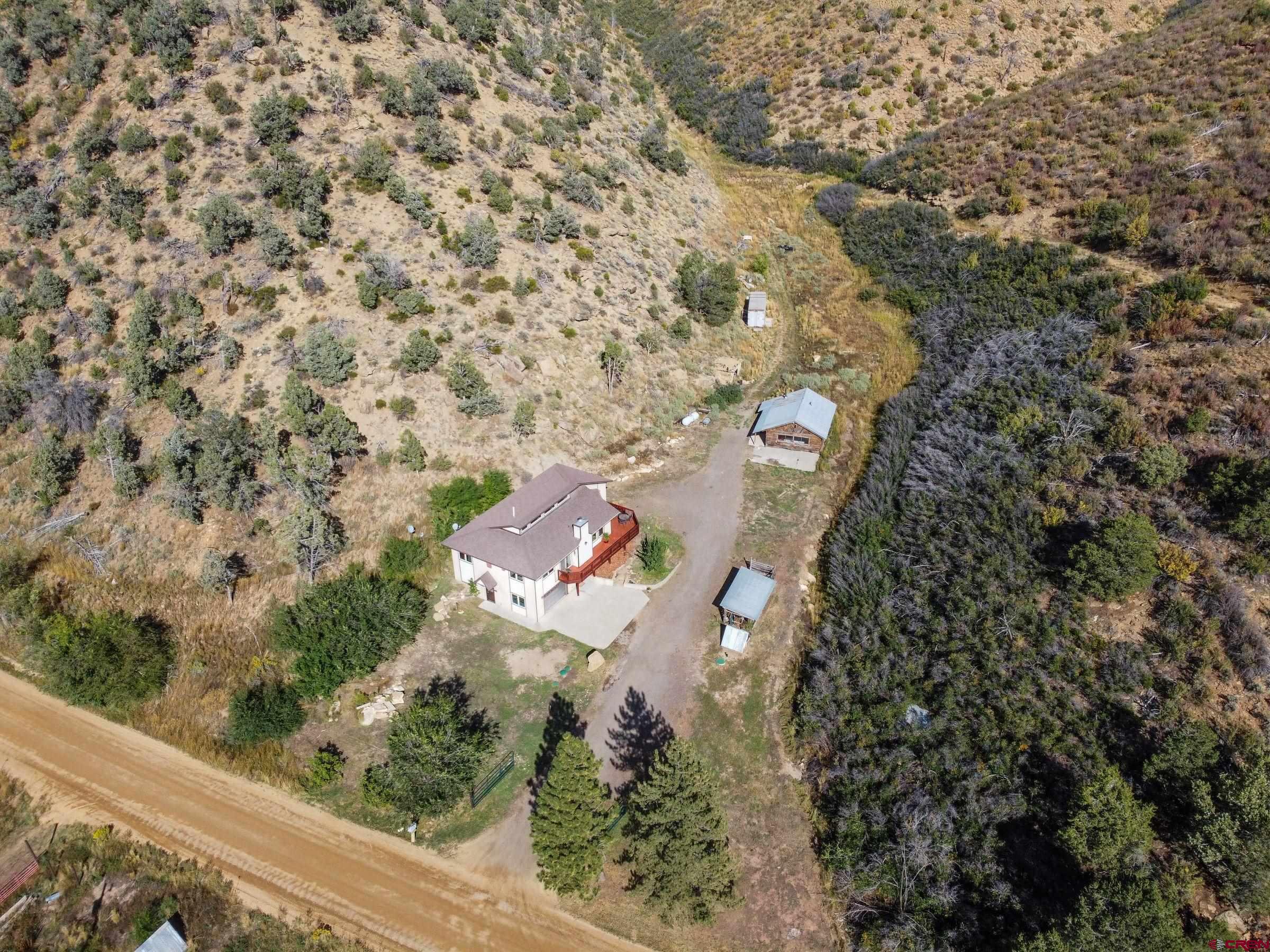 an aerial view of residential house with outdoor space