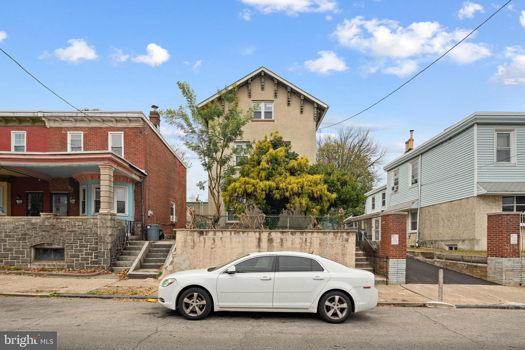 a car parked in front of a house