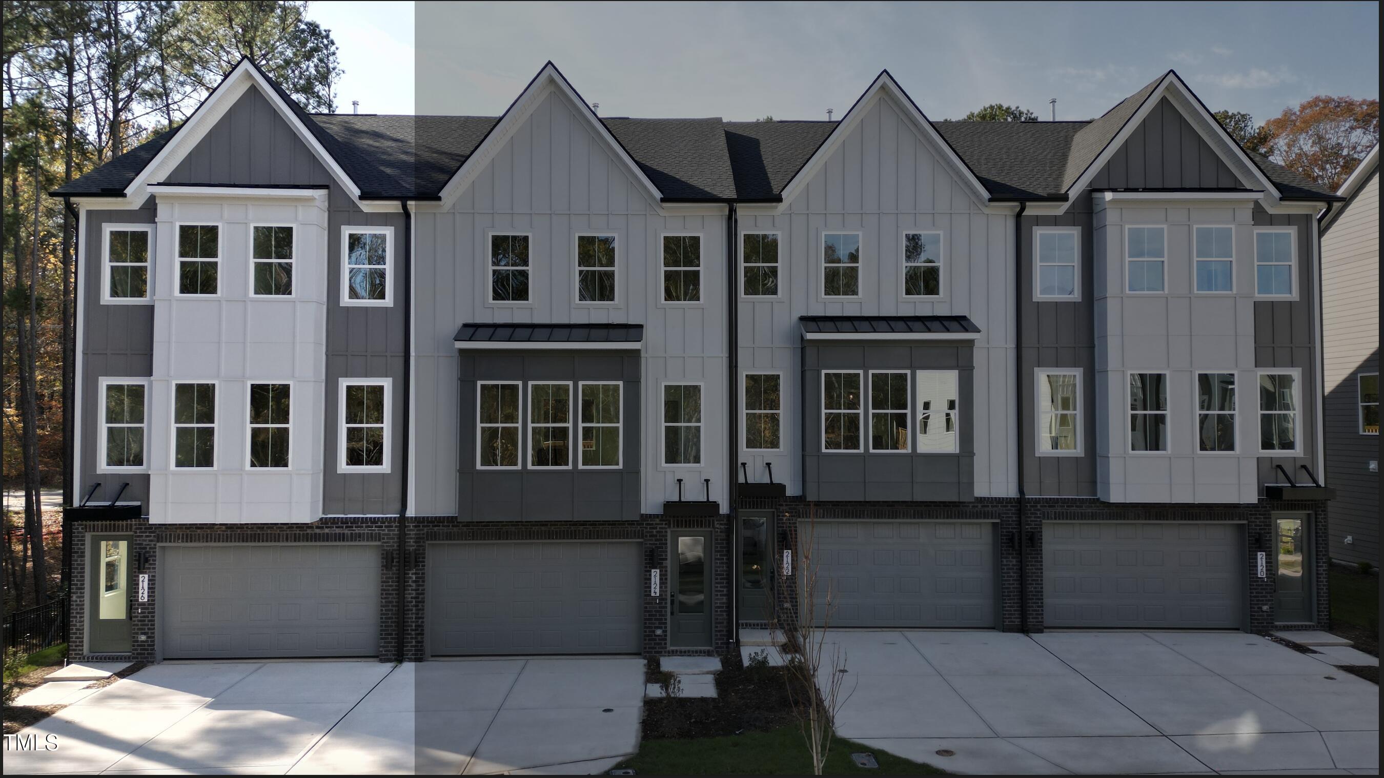 a front view of a house with many windows