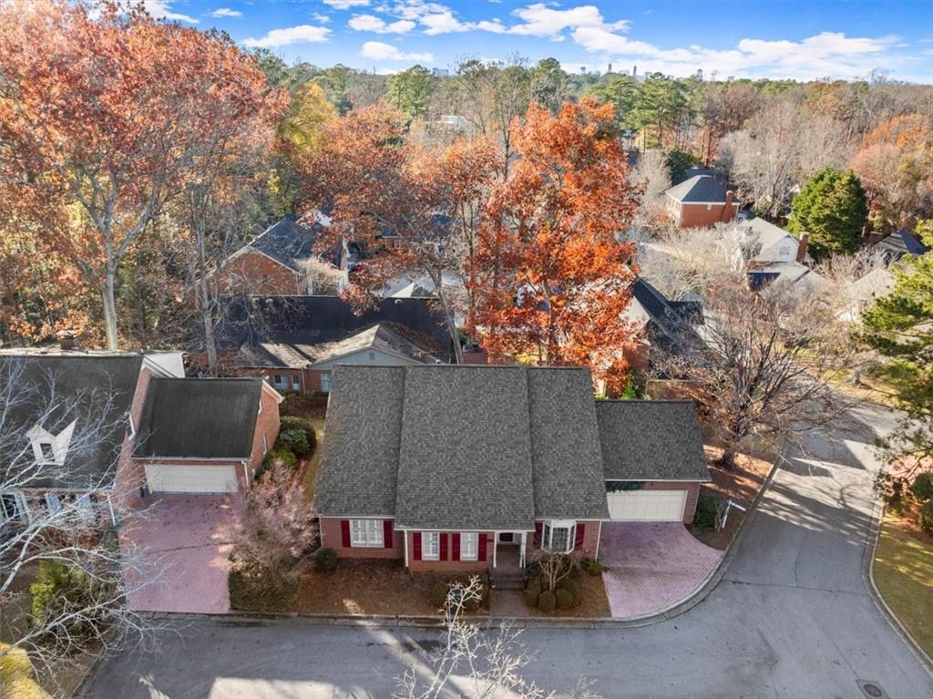 an aerial view of a house with yard swimming pool and outdoor seating