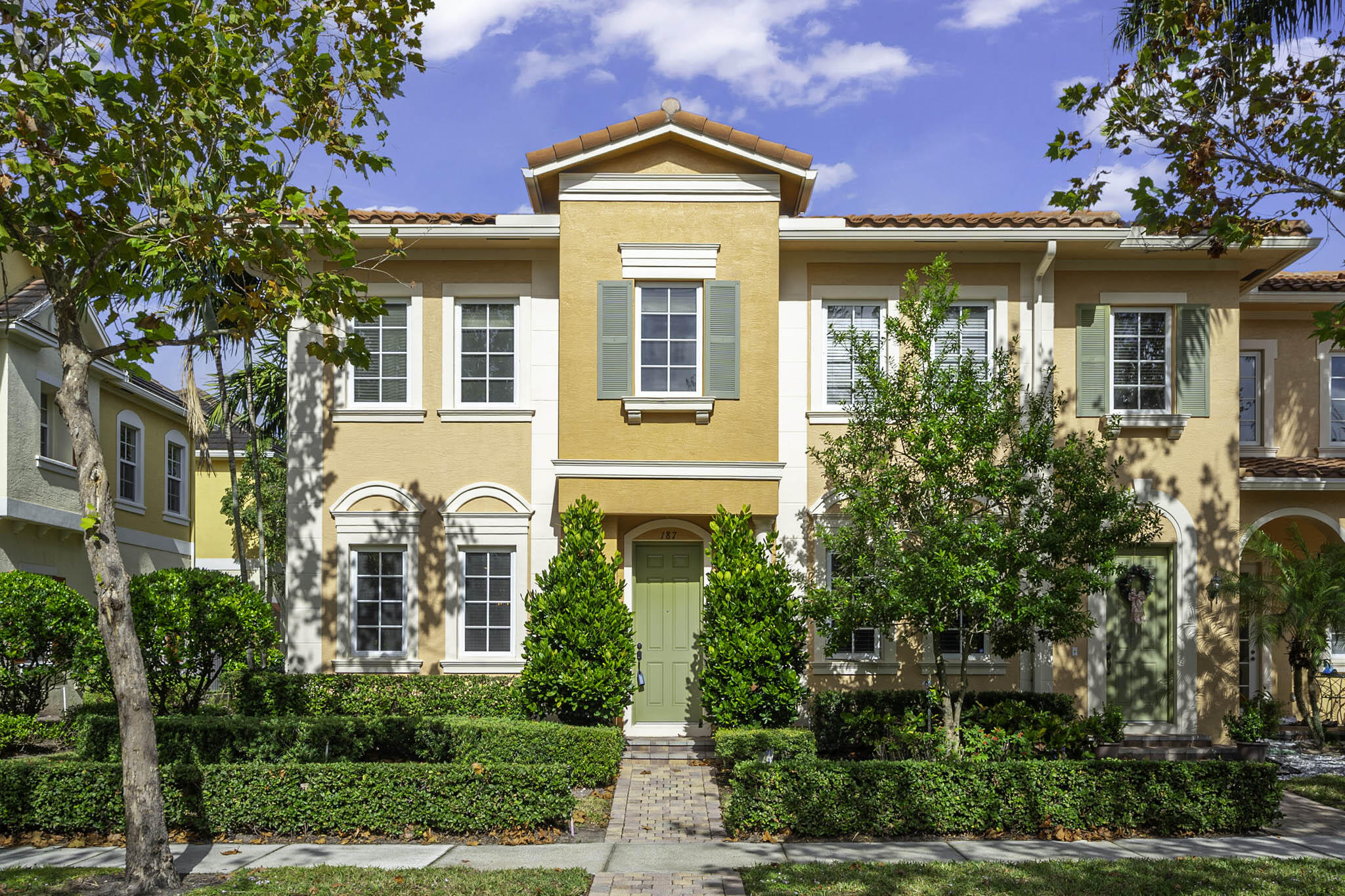 front view of a house with a yard