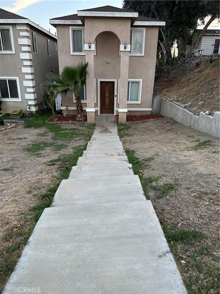 a front view of a house with yard