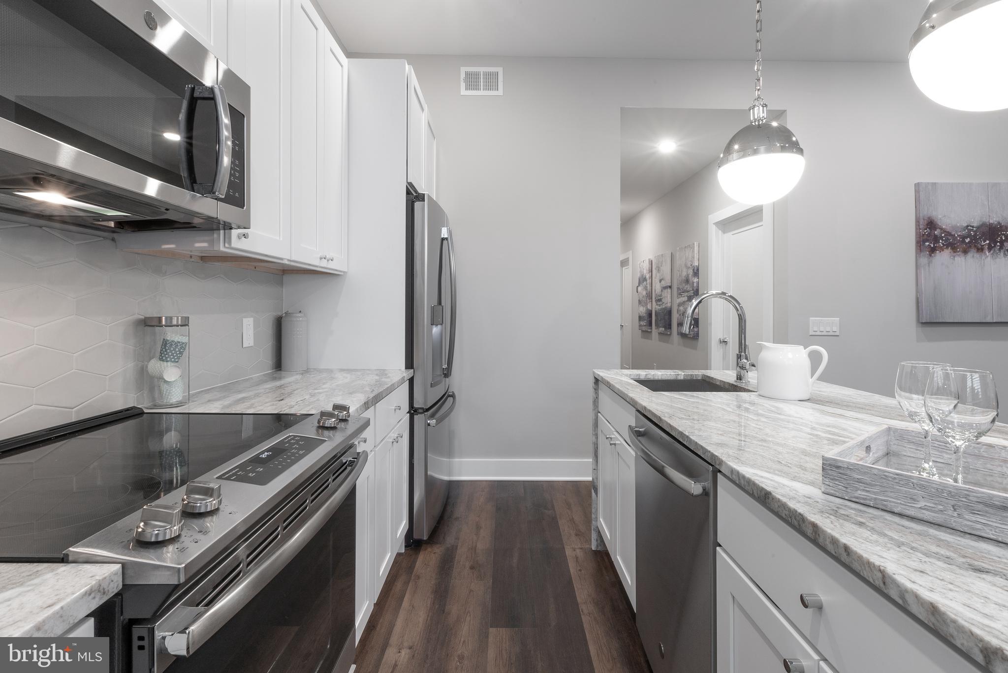 a kitchen with a stove and a sink