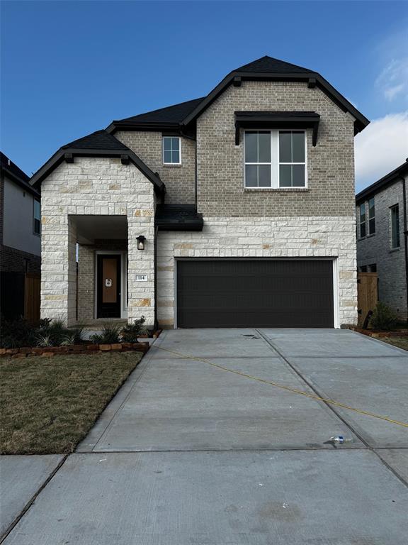 a front view of a house with yard