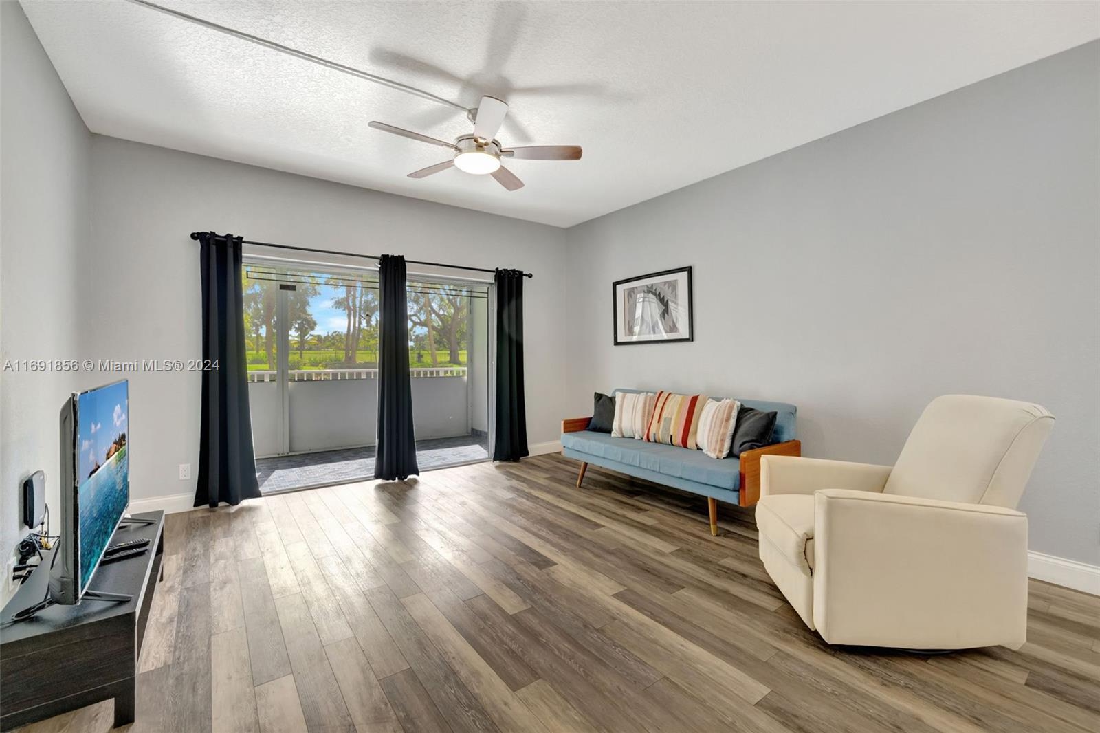 a view of a livingroom with furniture and wooden floor