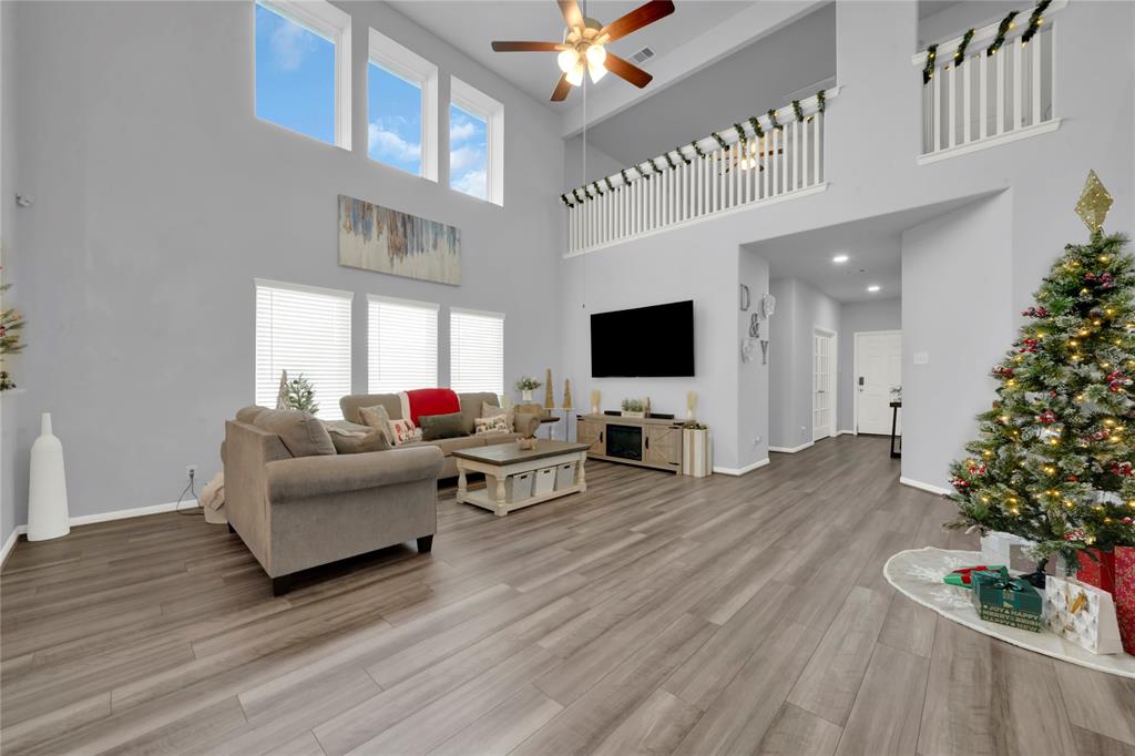 Expansive living room with high ceilings & abundant natural light.