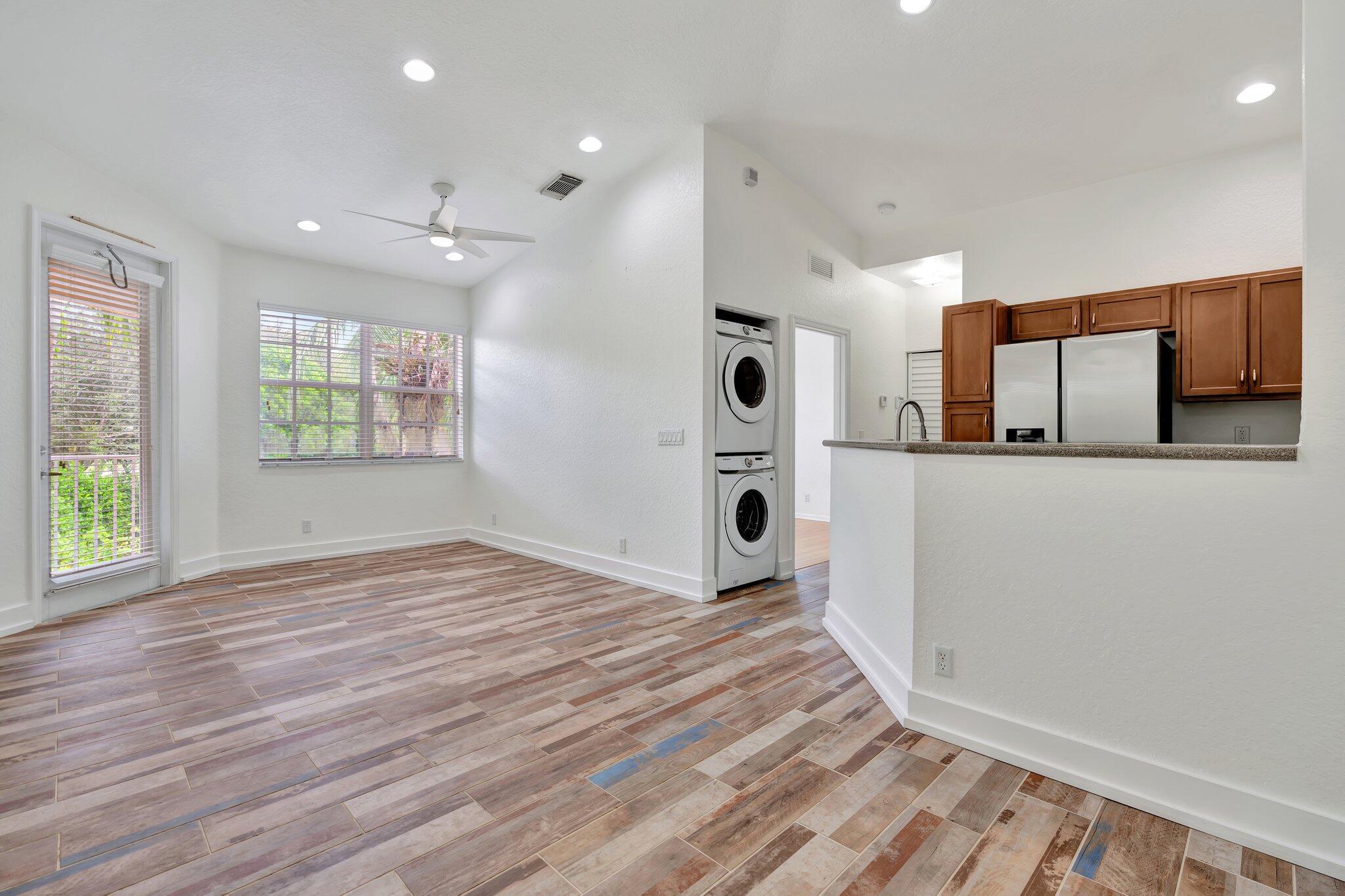 a view of kitchen and utility room with wooden floor