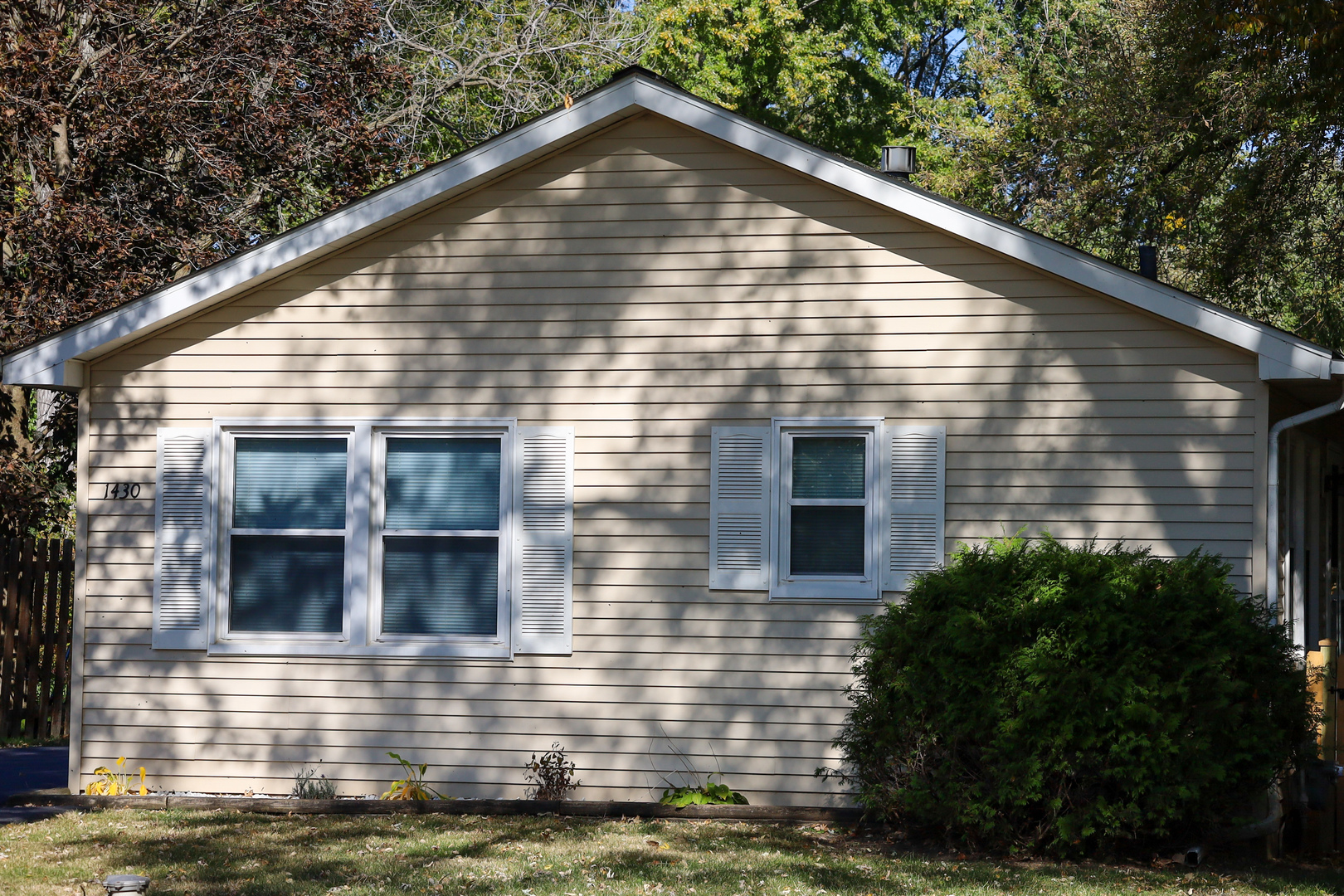 a view of house with yard