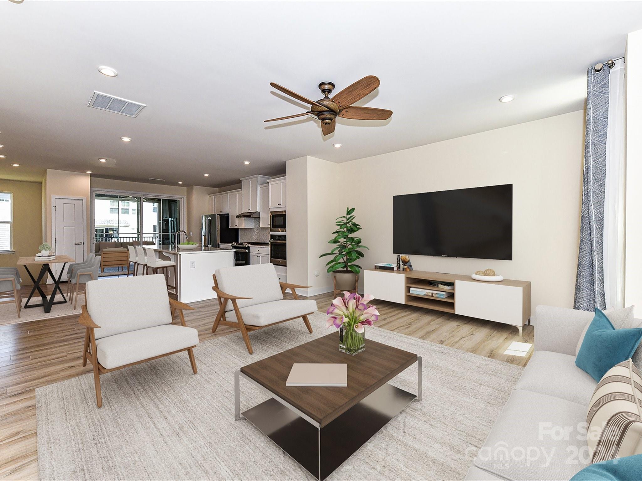 a living room with furniture and a flat screen tv