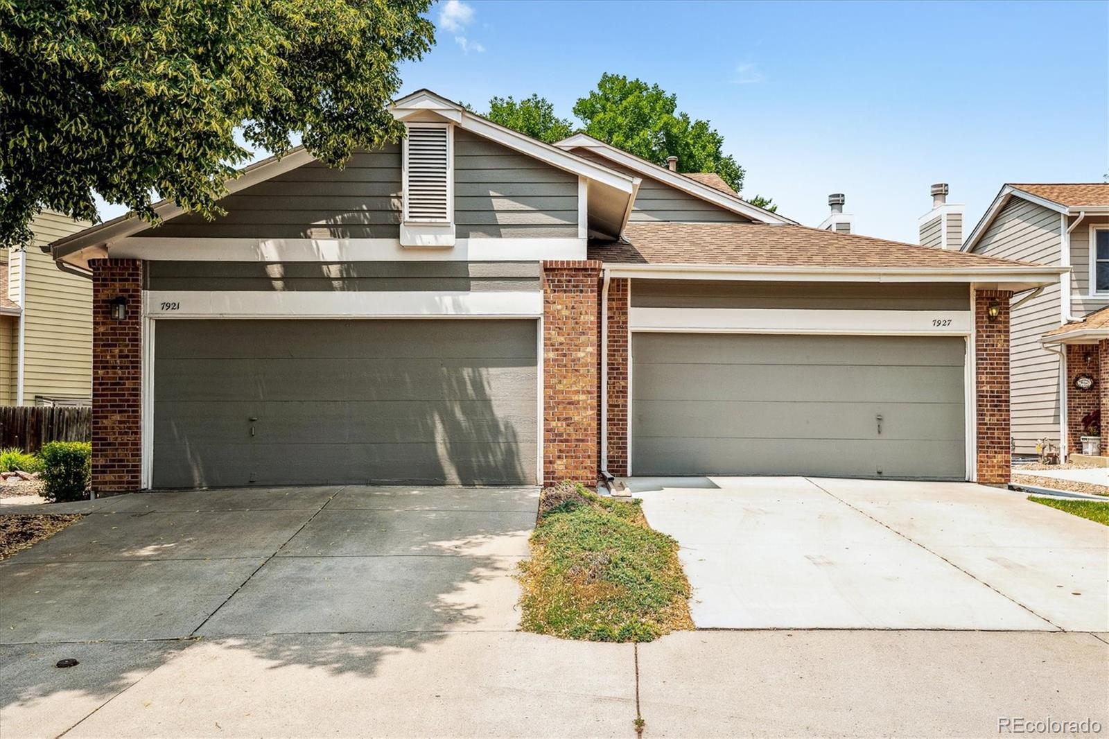 a front view of a house with a garage