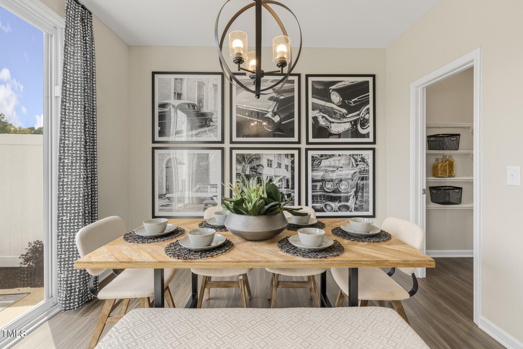 a view of a dining room with furniture window and wooden floor