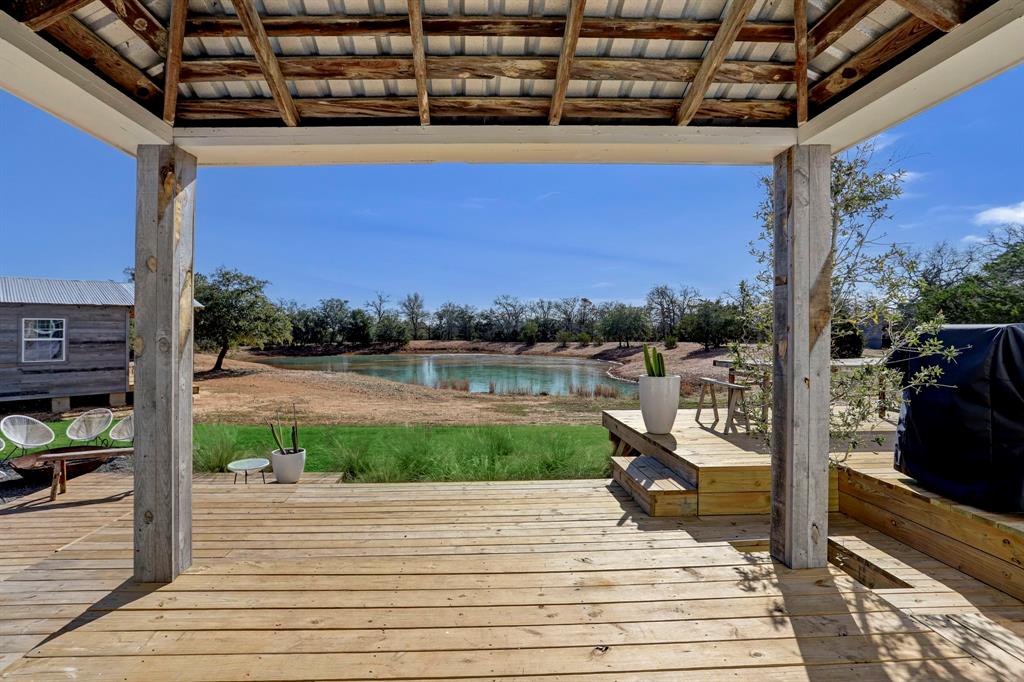 a view of a balcony with wooden floor and outdoor space