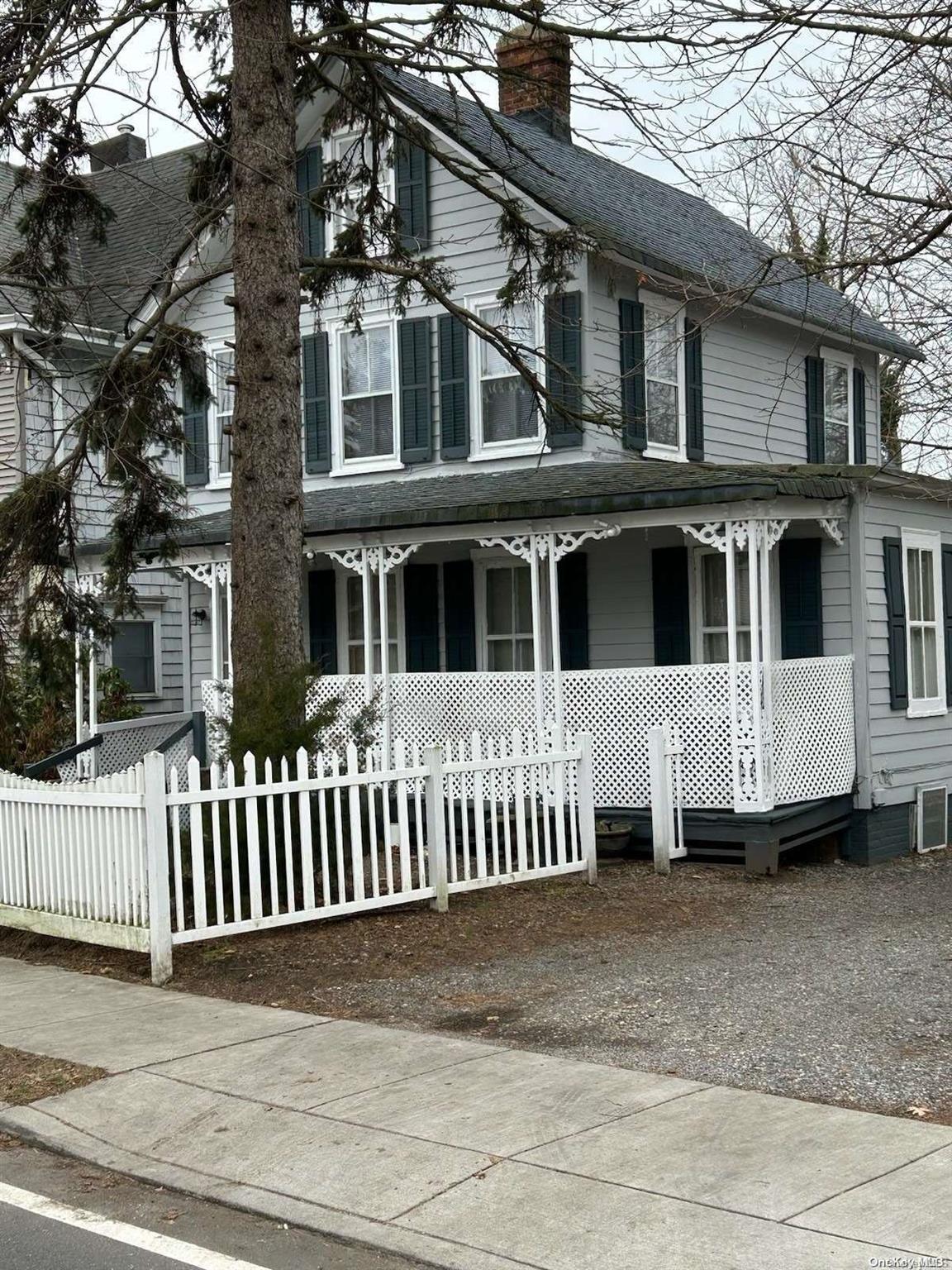 a front view of a house with a porch